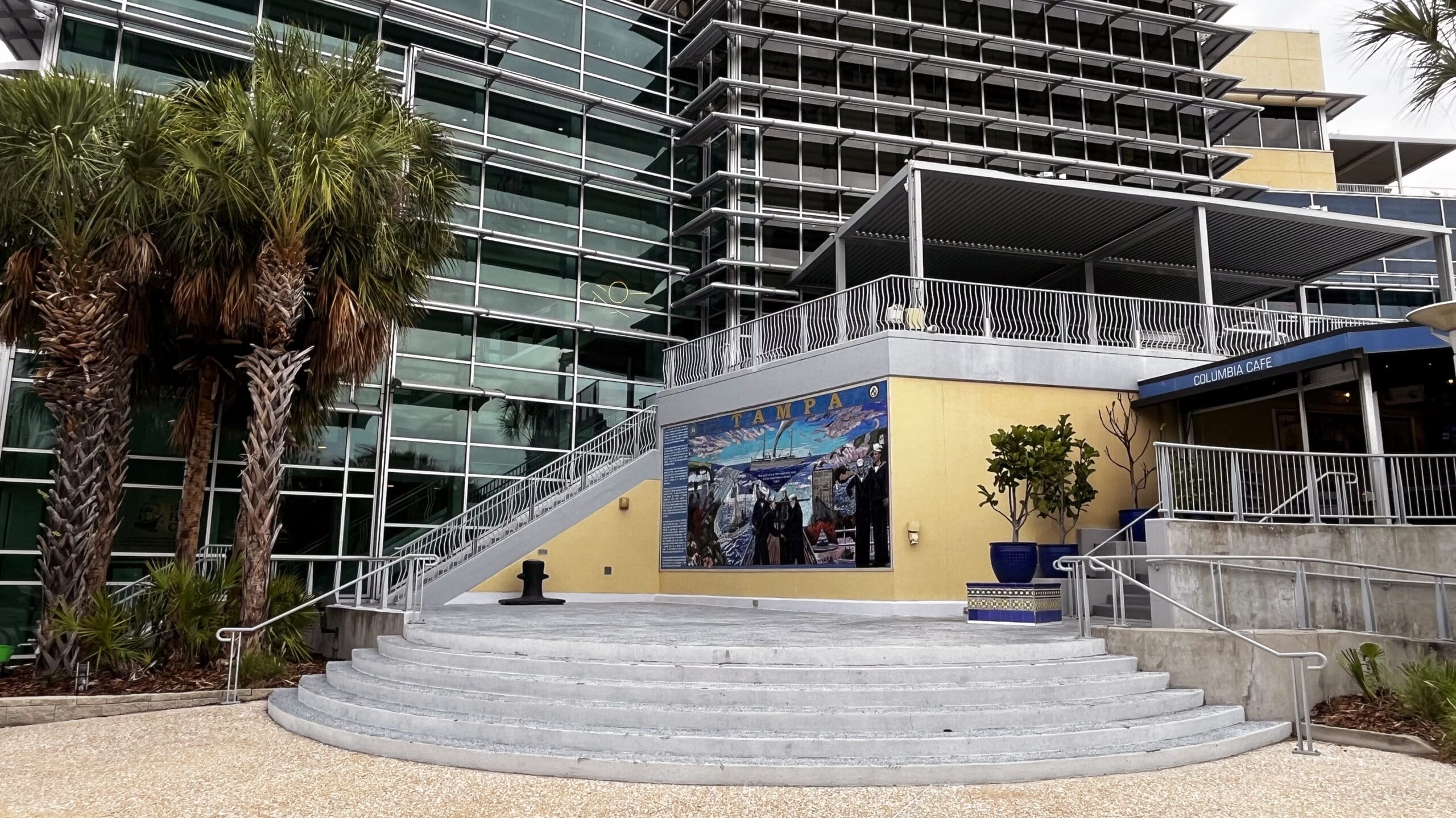 Wide view of the Tampa Bay History Center exterior with the Cutter Tampa mosaic mural near the Columbia Cafe.